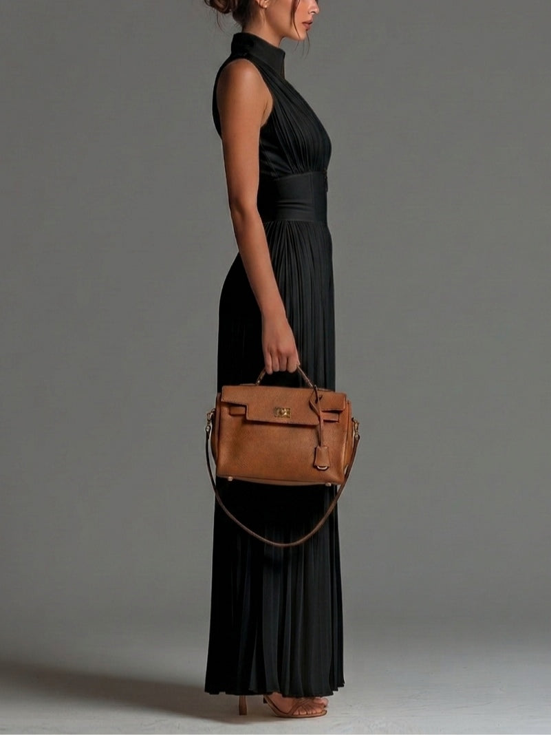 Black sleeveless jumpsuit with V-neck, zipper, pleated, and wide-leg in chiffon